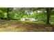 Charming single-story home featuring a covered front porch and a well-maintained lawn with mature trees at 6140 Barclay Ln, Clover, SC 29710