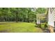 Expansive front yard with mature trees and an outdoor carport area at 6140 Barclay Ln, Clover, SC 29710