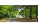 Charming home nestled among mature trees, creating a private and serene setting at 6140 Barclay Ln, Clover, SC 29710