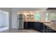 Bright kitchen featuring stainless steel refrigerator, blue cabinets and wood countertops at 6140 Barclay Ln, Clover, SC 29710