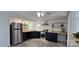 Modern kitchen featuring stainless steel appliances, blue cabinets, and wood countertops at 6140 Barclay Ln, Clover, SC 29710