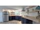 Modern kitchen featuring stainless steel appliances, blue cabinets, and wood countertops at 6140 Barclay Ln, Clover, SC 29710