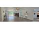 Open-concept living room featuring a stone fireplace and sliding glass doors to a deck at 6140 Barclay Ln, Clover, SC 29710