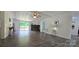 Spacious living room with hardwood floors, a fireplace, and sliding glass doors to the deck at 6140 Barclay Ln, Clover, SC 29710