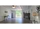Bright living room with a stone fireplace and sliding glass doors to the outside at 6140 Barclay Ln, Clover, SC 29710