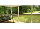 Relaxing front porch view with swing and tranquil views of the surrounding yard at 6140 Barclay Ln, Clover, SC 29710