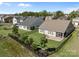 An aerial view of the backyard and patio, surrounded by a well-maintained black metal fence at 6531 Wildbrook Dr, Charlotte, NC 28269