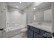Bathroom with bathtub, shower, toilet, and blue vanity sink at 6531 Wildbrook Dr, Charlotte, NC 28269