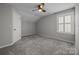 Bedroom with neutral walls, carpet floors, a ceiling fan, and a window at 6531 Wildbrook Dr, Charlotte, NC 28269