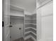 Walk-in closet with built-in shelves and ample storage, for organized convenience at 6531 Wildbrook Dr, Charlotte, NC 28269