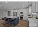 Spacious kitchen with a large island, stainless steel appliances, and modern white cabinetry at 6531 Wildbrook Dr, Charlotte, NC 28269