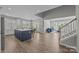 Open living area with kitchen, dining, and living spaces, featuring hardwood floors and ample natural light at 6531 Wildbrook Dr, Charlotte, NC 28269