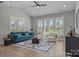 Comfortable living room offering stylish decor, hardwood floors, and plenty of natural light from large windows at 6531 Wildbrook Dr, Charlotte, NC 28269