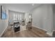 A home office with a desk, chairs, and many windows for natural light at 6531 Wildbrook Dr, Charlotte, NC 28269