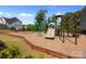Community playground offering swings and climbing structures for recreation at 6531 Wildbrook Dr, Charlotte, NC 28269