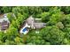 An aerial view of the sprawling property featuring a pool, manicured lawns, and mature trees at 7017 S Providence Rd, Waxhaw, NC 28173