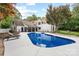Beautiful backyard with a refreshing pool, lounge chairs, and a well-manicured lawn at 7017 S Providence Rd, Waxhaw, NC 28173