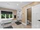 This bathroom features a soaking tub, a modern shower, and neutral tiling at 7017 S Providence Rd, Waxhaw, NC 28173