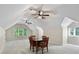 Spacious bonus room with natural light and fan, perfect for Gathering activities at 7017 S Providence Rd, Waxhaw, NC 28173