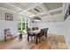 Dining room features a wood floor, decorative ceiling, and wainscoting at 7017 S Providence Rd, Waxhaw, NC 28173