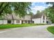 Beautiful home with a brick exterior, complemented by a concrete driveway and lush greenery at 7017 S Providence Rd, Waxhaw, NC 28173