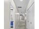 The hallway is long with carpet and has white walls and white doors at 7017 S Providence Rd, Waxhaw, NC 28173