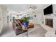Open concept room featuring a kitchen, fireplace, hardwood floors, and furniture at 7017 S Providence Rd, Waxhaw, NC 28173