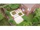 Aerial view of the backyard showcasing a professionally landscaped patio area and lush greenery at 7031 Walton Heath Ln, Charlotte, NC 28277