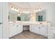 Bright bathroom with double sink vanity, multiple mirrors, and ample storage, creating a functional space at 7031 Walton Heath Ln, Charlotte, NC 28277