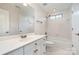 Well-lit bathroom with a single sink vanity, tub-shower combo, and neutral tones, creating a calming space at 7031 Walton Heath Ln, Charlotte, NC 28277
