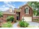 Charming brick home featuring a manicured lawn, two-car garage, and inviting front entrance at 7031 Walton Heath Ln, Charlotte, NC 28277
