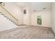The spacious living room features carpet flooring and neutral paint at 7031 Walton Heath Ln, Charlotte, NC 28277