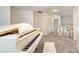 Bright landing featuring an elegant white piano and neutral decor, creating a welcoming and sophisticated space at 7031 Walton Heath Ln, Charlotte, NC 28277