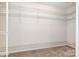 Spacious walk-in closet featuring wire shelving, offering ample storage and organization at 7031 Walton Heath Ln, Charlotte, NC 28277