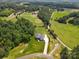 Stunning aerial view of home showcasing landscaping, driveway, and surrounding green landscape and land at 867 Bellegray Rd, Clover, SC 29710