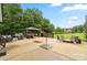 Expansive backyard with large patio, outdoor kitchen and fire pit, showcasing ample space for recreation at 867 Bellegray Rd, Clover, SC 29710