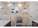 Luxurious bathroom with glass-enclosed shower, tile surround, and modern fixtures at 867 Bellegray Rd, Clover, SC 29710