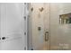 Modern bathroom featuring a luxurious shower with textured tile and sleek fixtures at 867 Bellegray Rd, Clover, SC 29710