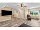 Cozy bonus room with wood floors, a ceiling fan, and natural light at 867 Bellegray Rd, Clover, SC 29710