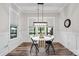 Bright dining area features wainscoting, modern light fixture and wood-look flooring at 867 Bellegray Rd, Clover, SC 29710