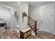 Inviting entryway with wood floors, stairs, and a convenient drop zone at 867 Bellegray Rd, Clover, SC 29710