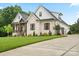 Beautiful home with a three car garage, well manicured lawn and beautiful trees at 867 Bellegray Rd, Clover, SC 29710