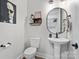 Charming half bathroom featuring a pedestal sink and tasteful decor at 867 Bellegray Rd, Clover, SC 29710