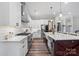 Modern kitchen with stainless steel appliances, a spacious island, and white cabinetry at 867 Bellegray Rd, Clover, SC 29710