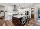 Modern kitchen featuring white cabinets, stainless steel appliances, and center island with bar stool seating at 867 Bellegray Rd, Clover, SC 29710