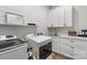 Functional laundry room with modern appliances, ample counter space, and stylish decor at 867 Bellegray Rd, Clover, SC 29710