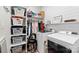 Laundry room features washer, dryer, shelving, and storage for laundry essentials at 867 Bellegray Rd, Clover, SC 29710
