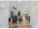 Spacious open-concept living room with hardwood floors seamlessly connects to the dining area at 867 Bellegray Rd, Clover, SC 29710