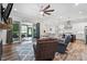 Bright living room and kitchen boasts fireplace with sliding door access to the outdoor space and comfortable furniture at 867 Bellegray Rd, Clover, SC 29710