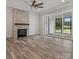 Bright living room boasts fireplace with sliding door access to the outdoor space and a ceiling fan at 867 Bellegray Rd, Clover, SC 29710
